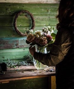 flower designer working on a floral arrangement