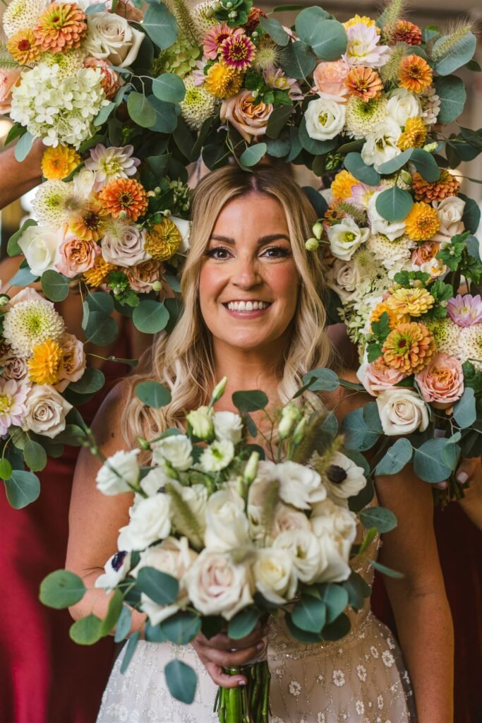 bride surrounded by flowers