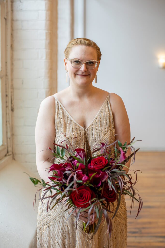 bride holding wedding flowers