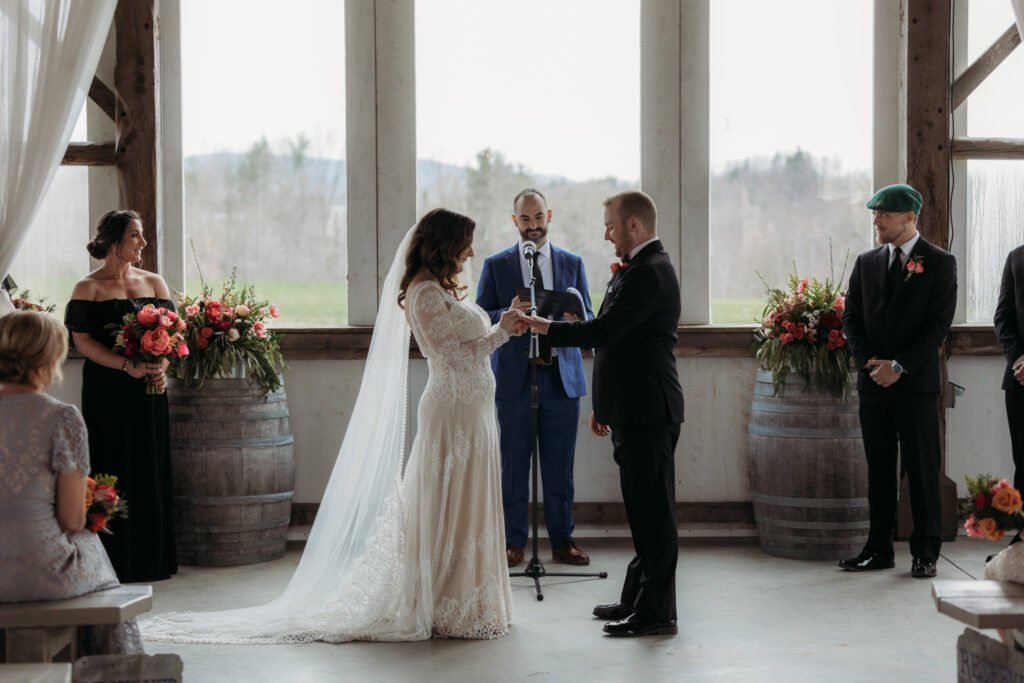 Bride and groom, spring wedding at Valley View Farm, Haydenville. Flowers include locally grown tulips and stock, American grown peonies.