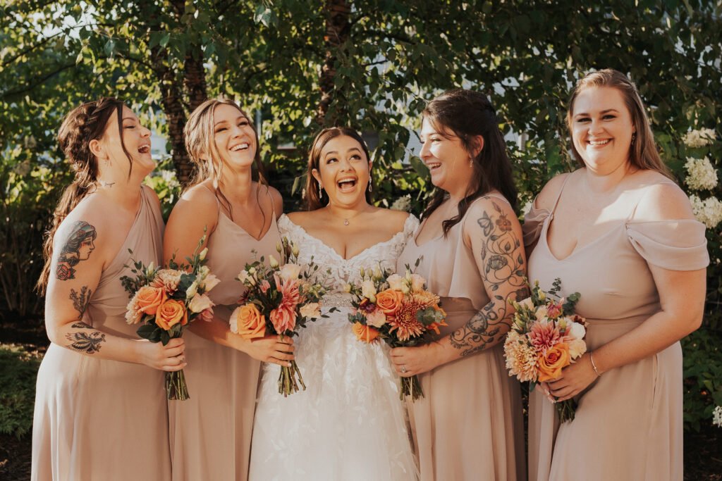 bride and bridesmaids, terracotta wedding flowers
