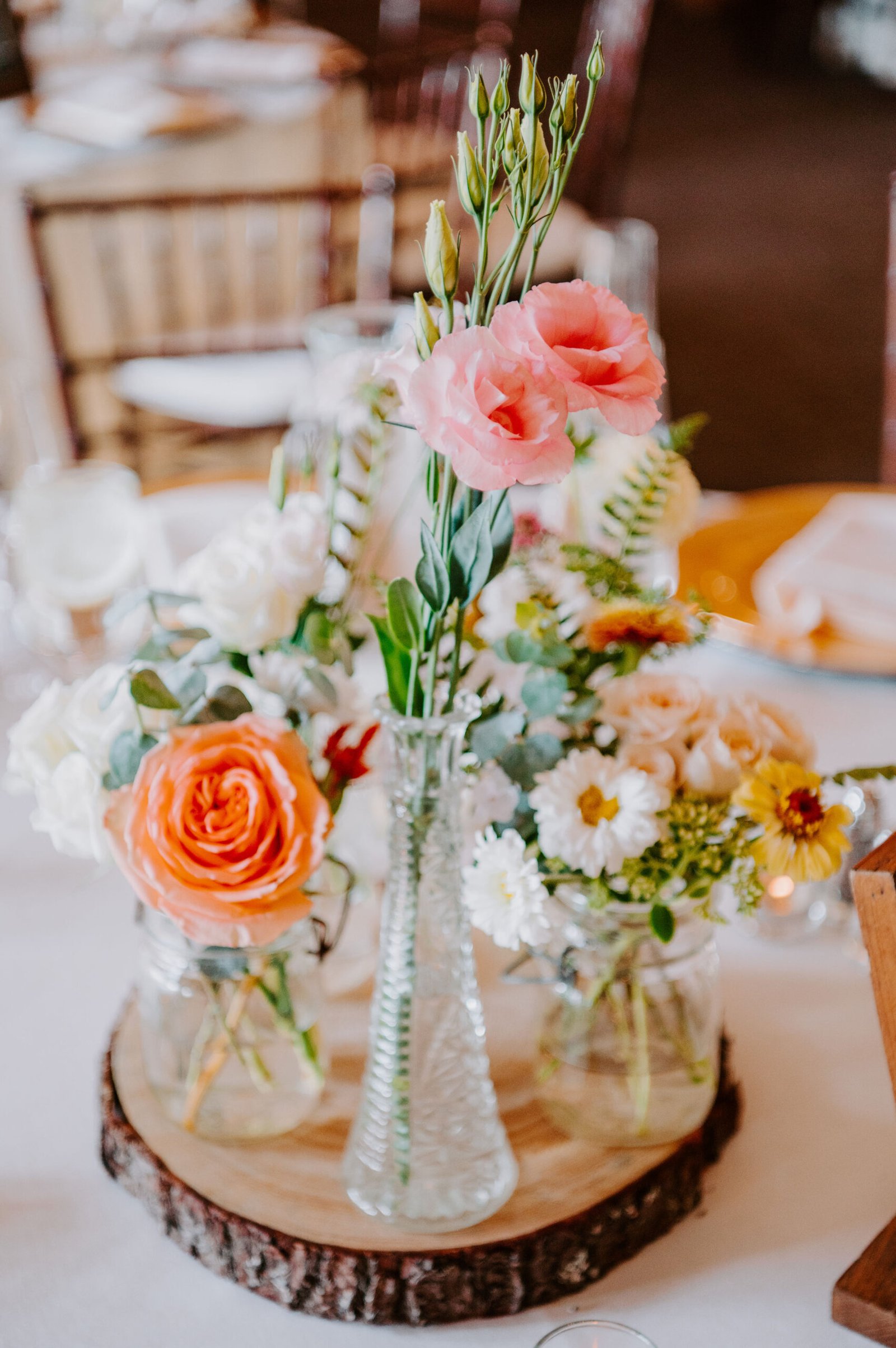 Eclectic vase centerpieces, Summer wedding flowers at Harrington Farm, Massachusetts.
