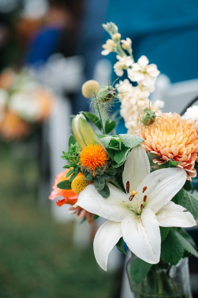 flowers on aisle at wedding ceremony